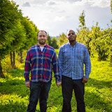 Scott and Travis in the orchard